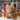 Large Natural Inkari Stuffed Alpaca in brown on display with yarn background