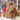 Brown Monsterfluff Inkari Stuffed Alpaca Animal on display in yarn store.