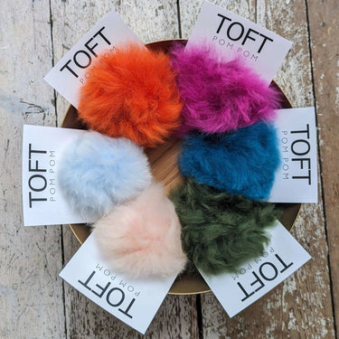 TOFT Alpaca Pom Pom | Interchangeable & Ethical Luxury, Color: Coral, Swap your look in seconds with TOFT’s bright, ethical alpaca pom poms. Each snap-on pom is cruelty-free and crafted from naturally sourced fur., Knit With Me