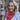 Woman wearing a hand-knitted scarf at Beginner Knitting Class