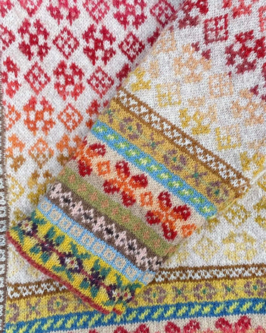 Colorful knitted fabric showcasing patterns created from Natural Yarn Dyeing techniques.