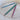 KnitPro Dreamz Wood Cable Needles with grooves to prevent slipping, shown in blue, green, and purple on a textured surface.