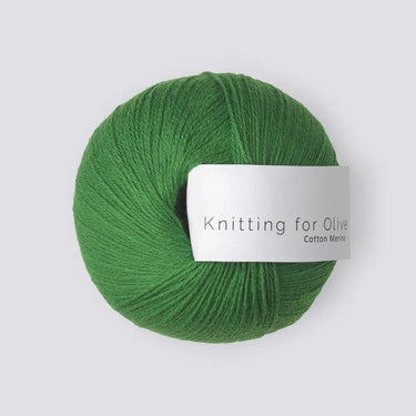 Green ball of Knitting For Olive COTTON MERINO yarn, blend of cotton and Merino wool, for versatile knitting projects all year round.