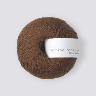 Knitting for Olive COTTON MERINO yarn ball in brown, soft blend of cotton and merino wool, perfect for year-round knitting projects.