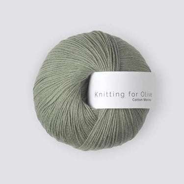 Knitting For Olive COTTON MERINO yarn ball in pastel green, soft cotton and RWS certified Merino wool blend for versatile year-round use.