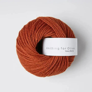 Knitting for Olive Heavy Merino yarn in rust color, 100% Merino wool, natural structure, sourced from mulesing-free sheep in New Zealand.