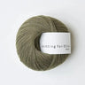 Knitting for olive Merino in Dusty Olive colour at Knit With Me yarn shop with neutral background