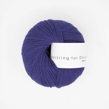 Knitting For Olive Merino yarn in deep purple, fingering weight, perfect for cozy knits and ideal for outdoor adventures.