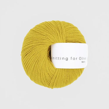 Knitting For Olive Merino yarn in yellow color, ideal for knitting, providing comfort and functionality for outdoor activities.