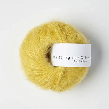Ball of Knitting for Olive Soft Silk Mohair yarn in yellow, blend of Kid Mohair and Mulberry silk, ideal for knitting projects.
