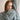 Model wearing a cozy cable knit sweater from Laine Magazine Issue 27 - Winter PRE-ORDER, showcasing winter knitting designs.