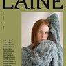 Cover of Laine Magazine Issue 27 - Winter featuring a model in a cozy cable knit, showcasing winter knitting designs.