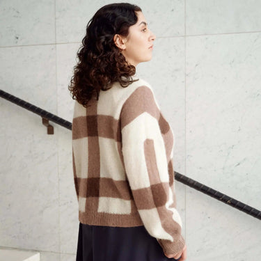 Model wearing a plaid knit sweater from Laine Magazine Issue 27 - Winter PRE-ORDER collection