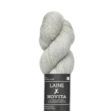 Gray skein of yarn with Laine Novita label on a white background