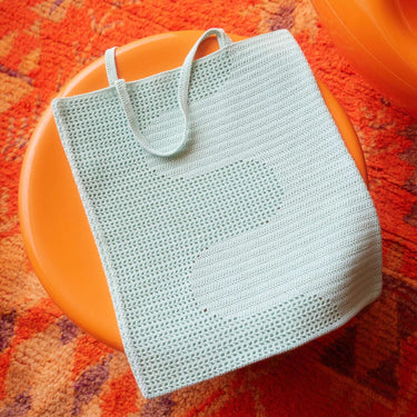 Let's Crochet Issue 2 by Laine featuring a stylish crocheted bag on vibrant orange background