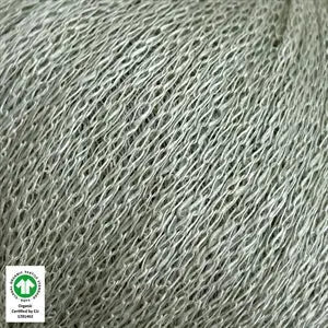 Close-up of Løvetand organic linen yarn by CaMaRose, ideal for summer knitwear and crochet, featuring a chainette texture in light grey.