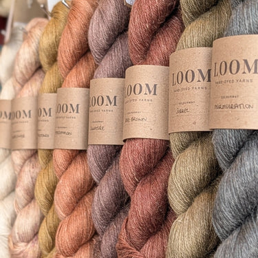 Loom Alpaca, Linen & Silk, 4ply yarn selection on a wall at Knit With Me yarn shop