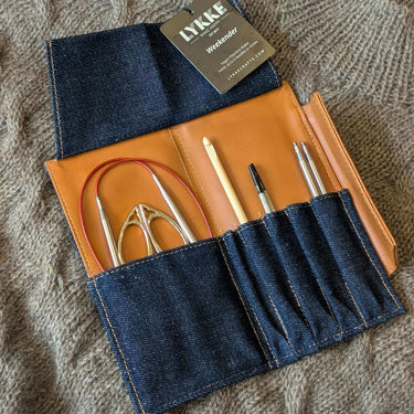 Knitting Needle Travel Case - LYKKE Weekender with denim and vegan leather, open to display knitting tools neatly organized inside.