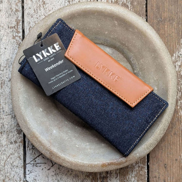 LYKKE Weekender Knitting Needle Travel Case in denim and vegan leather with tag, perfect for organizing knitting and crochet tools.