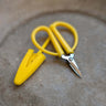 Mini Scissors with yellow silicone cover and silver blades, ideal for travel. Compact size 2.5" long, perfect for on-the-go cutting.