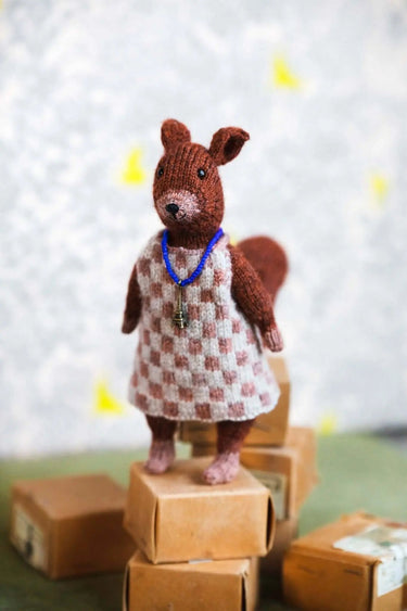 Laine | Mouche & Friends | Seamless Knitted Toy Patterns, , Knit 12 adorable toy animals with clothes in Mouche & Friends. A seamless knitting journey with stories, tutorials, and charming character design., Knit With Me
