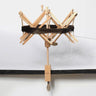 KnitPro Natural Wood Yarn Swift with a skein of yarn wound on, clamped to a table | Knit With Me