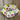 Group of labels for knitting projects in a bowl.
