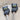 Stitch Stoppers cat design by Fox & Pine Stitches on knitting needles, preventing stitches from coming undone, essential knitting tool.