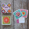 Granny Square Flowers Card Deck with crochet designs on rustic wood background.