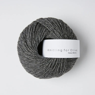 Knitting for Olive Heavy Merino yarn in dark grey color, showcasing its 100% natural merino wool texture and quality.