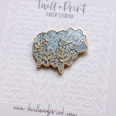 Twill + Print Enamel Pins - Little Glitter Sheep design with shiny enamel finish on a decorative card.
